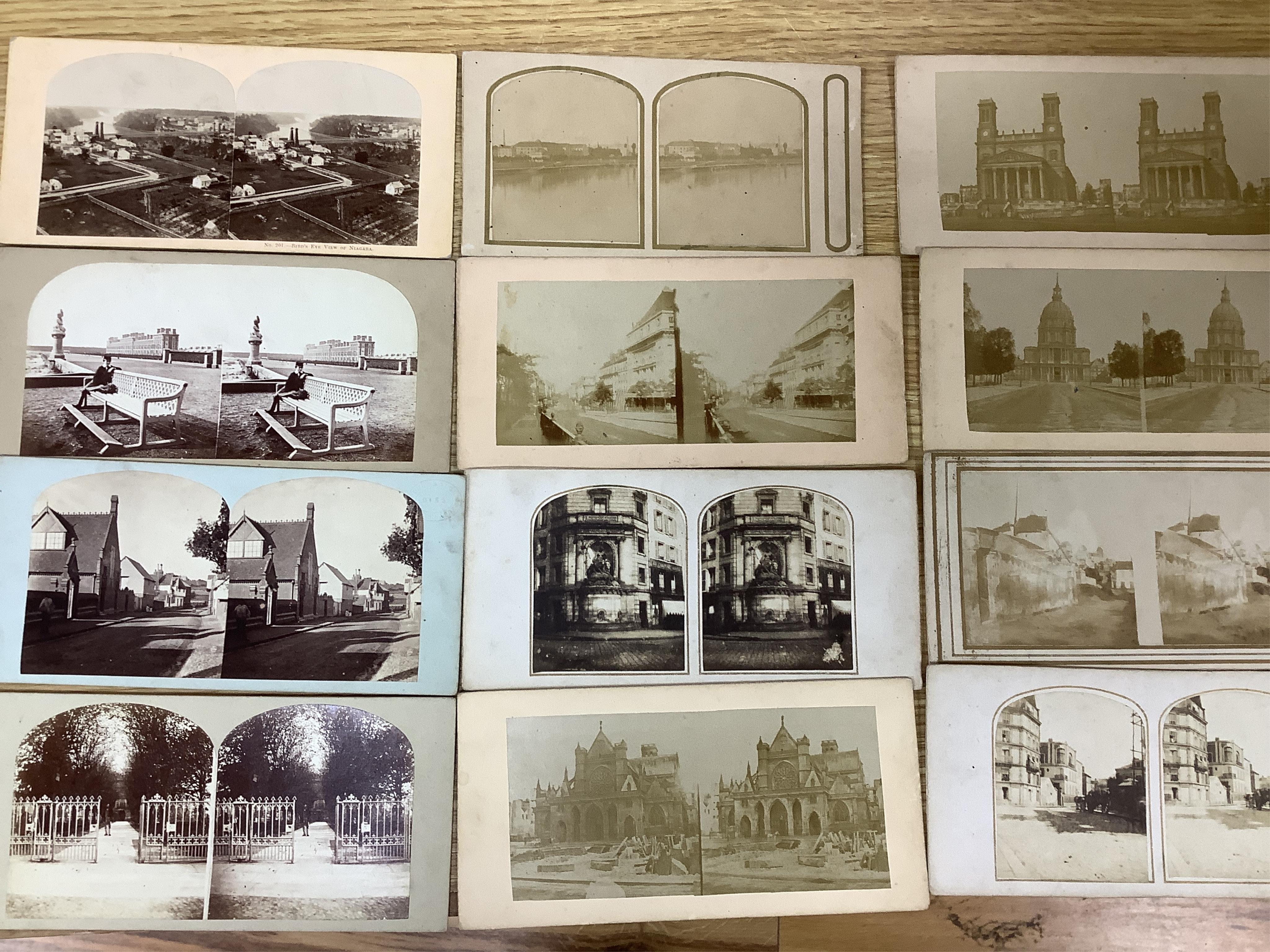 A late 19th century cased stereoscopic viewer together with topographical and other cards. Condition - fair